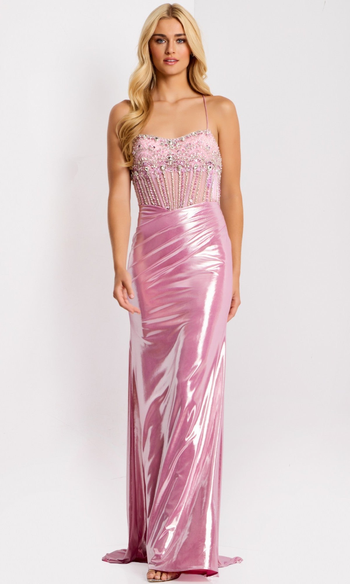 A woman in the Jovani 47325 long prom dress, featuring a sleeveless metallic satin sheath skirt and an embellished beaded corset bodice, stands against a plain white background.